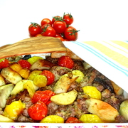 Телятина в сырной панировке, запеченная с баклажанами, картофелем и помидорами.